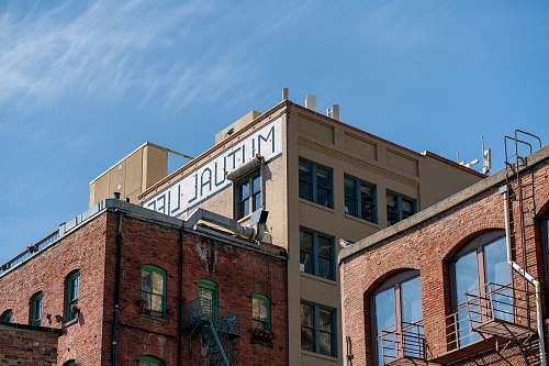 city low angle photography of building structure high rise